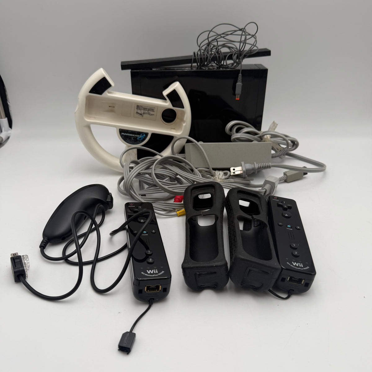 Nintendo Wii Black with 2 controllers + Cables + Wheel
