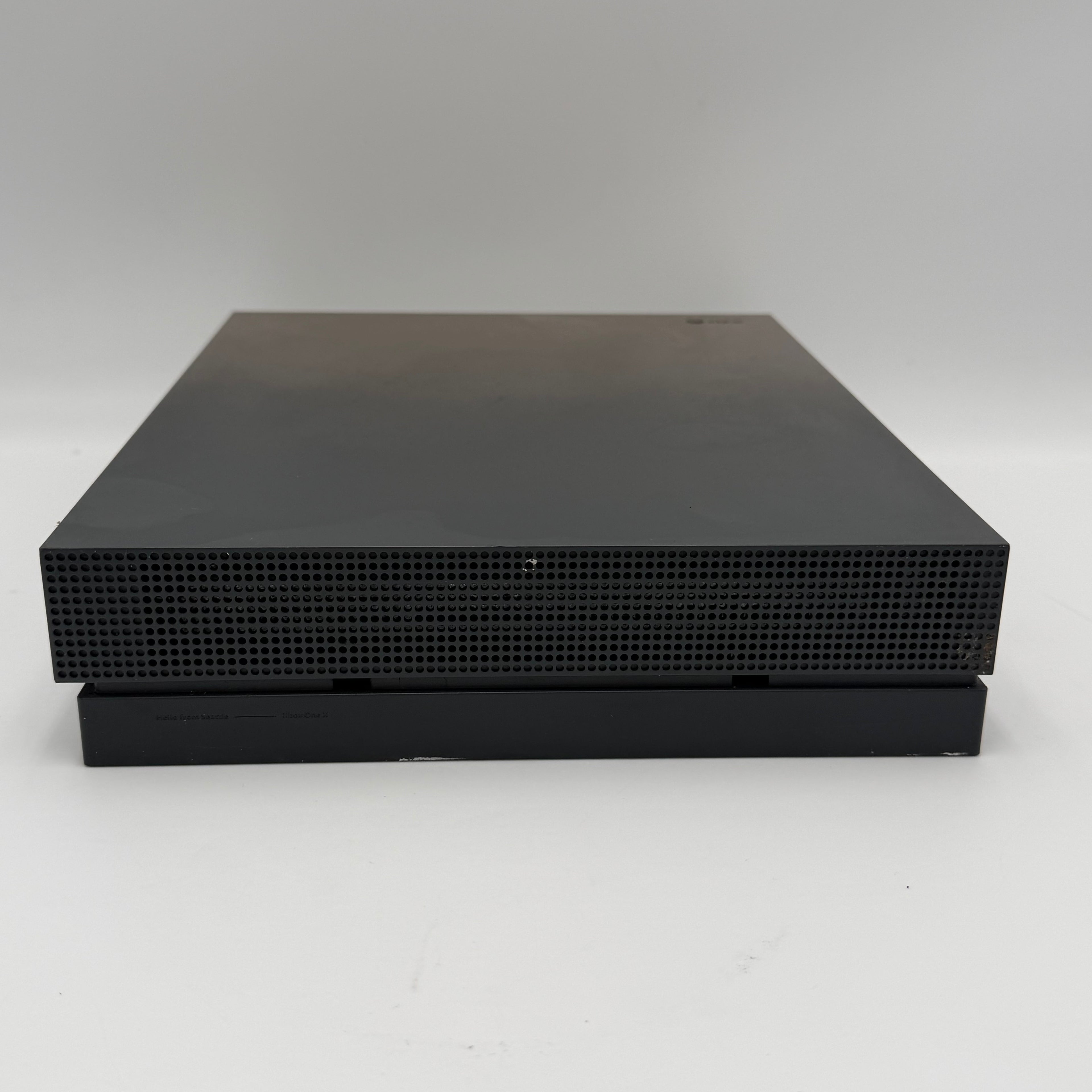 Microsoft Xbox One X with controller