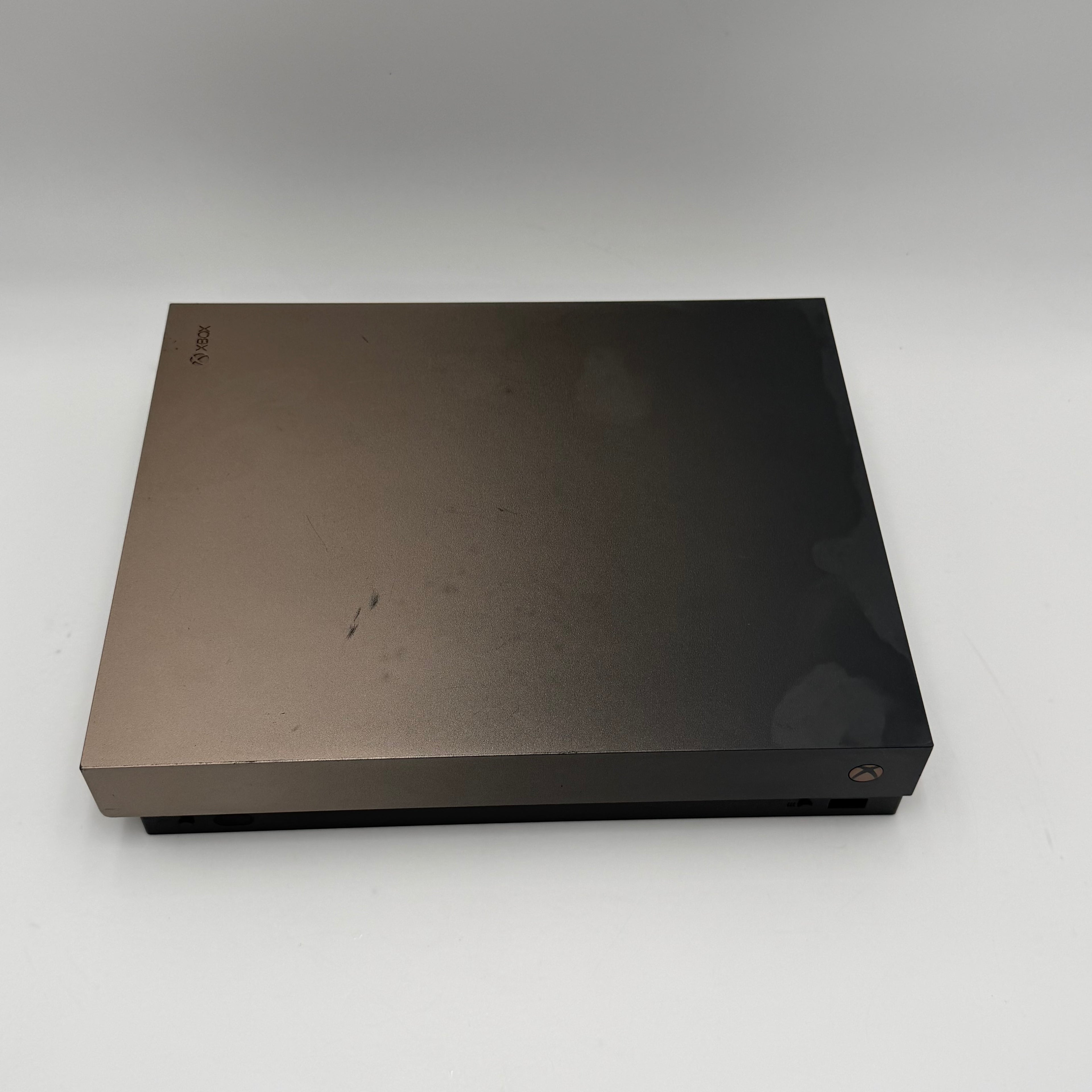 Microsoft Xbox One X with controller