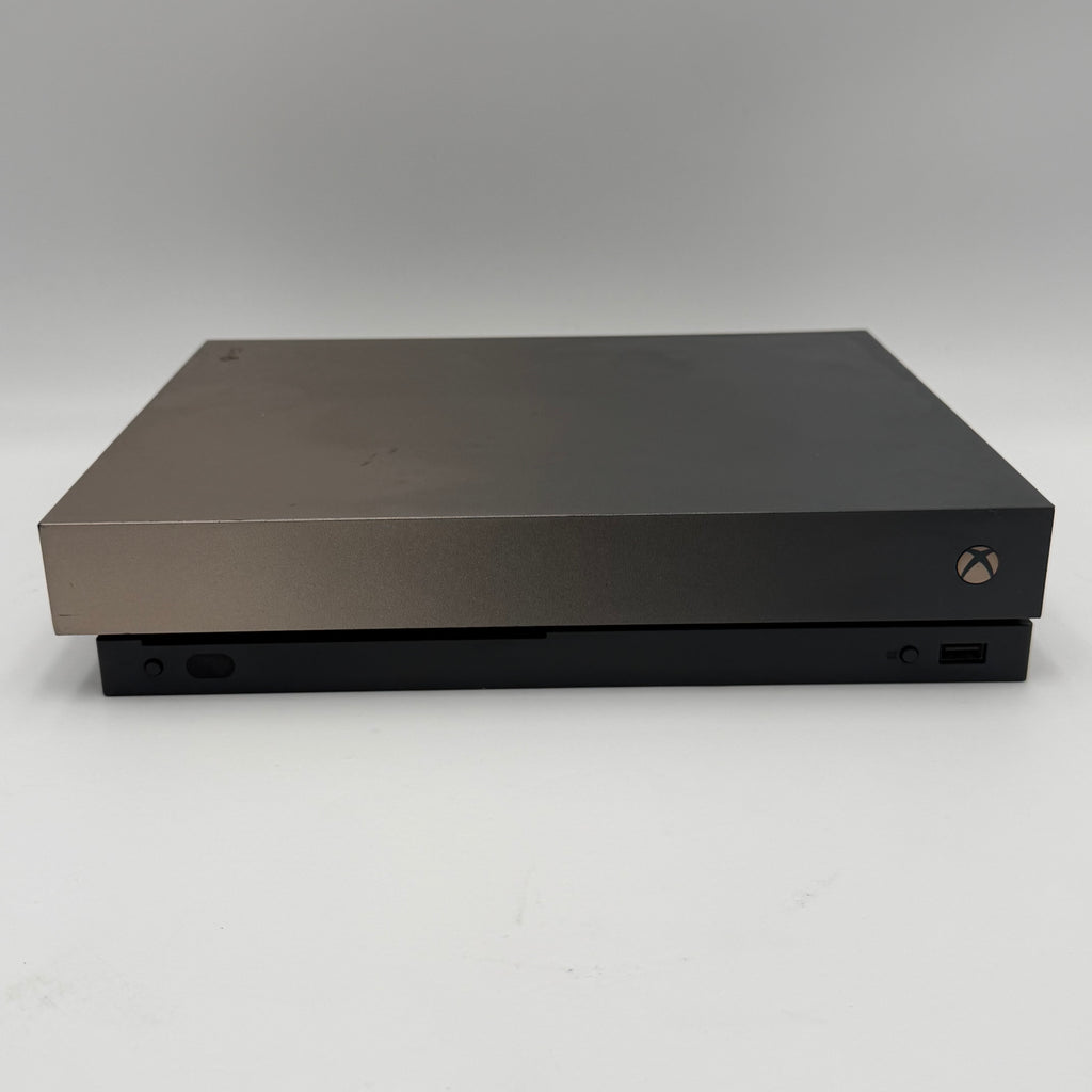 Microsoft Xbox One X with controller