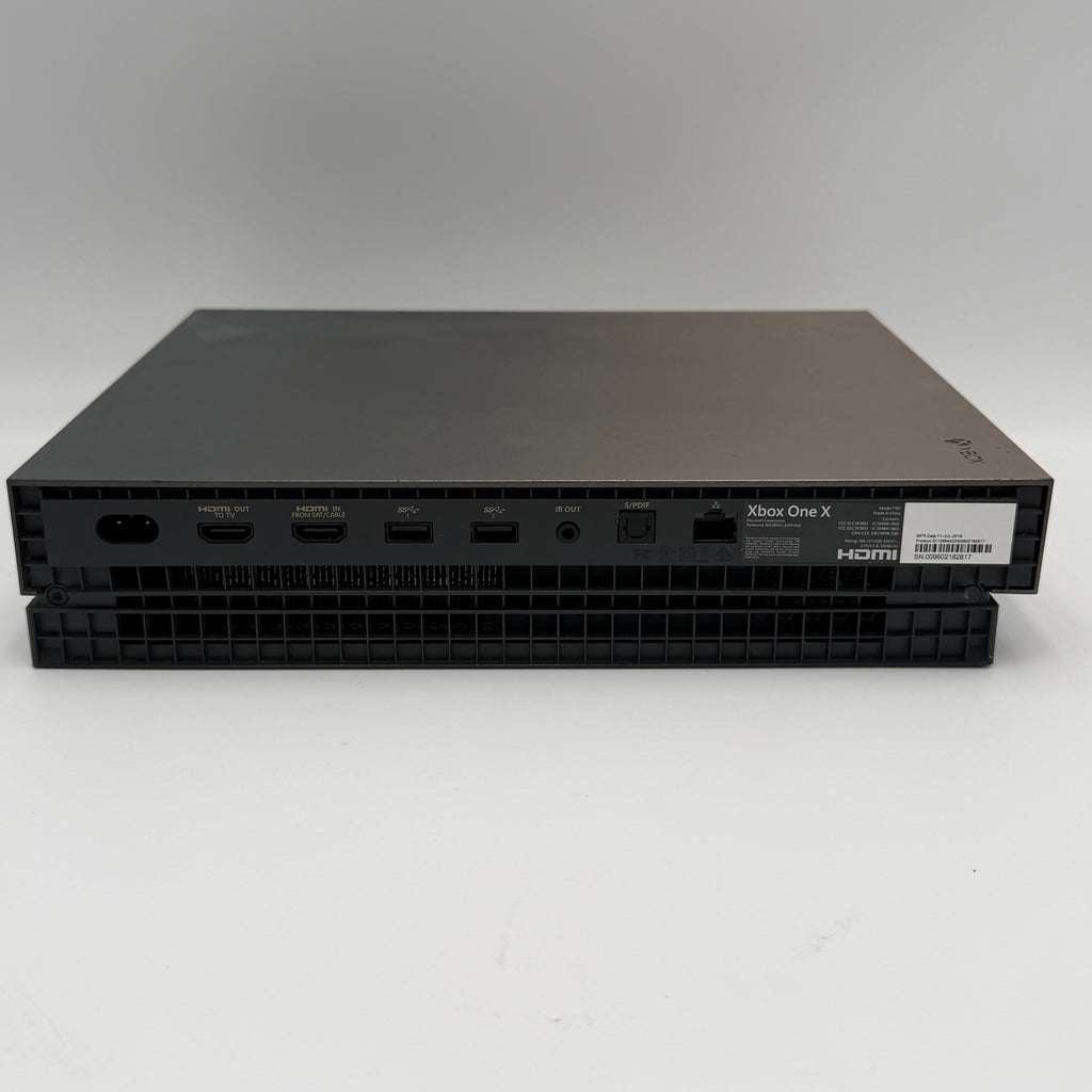 Microsoft Xbox One X with controller